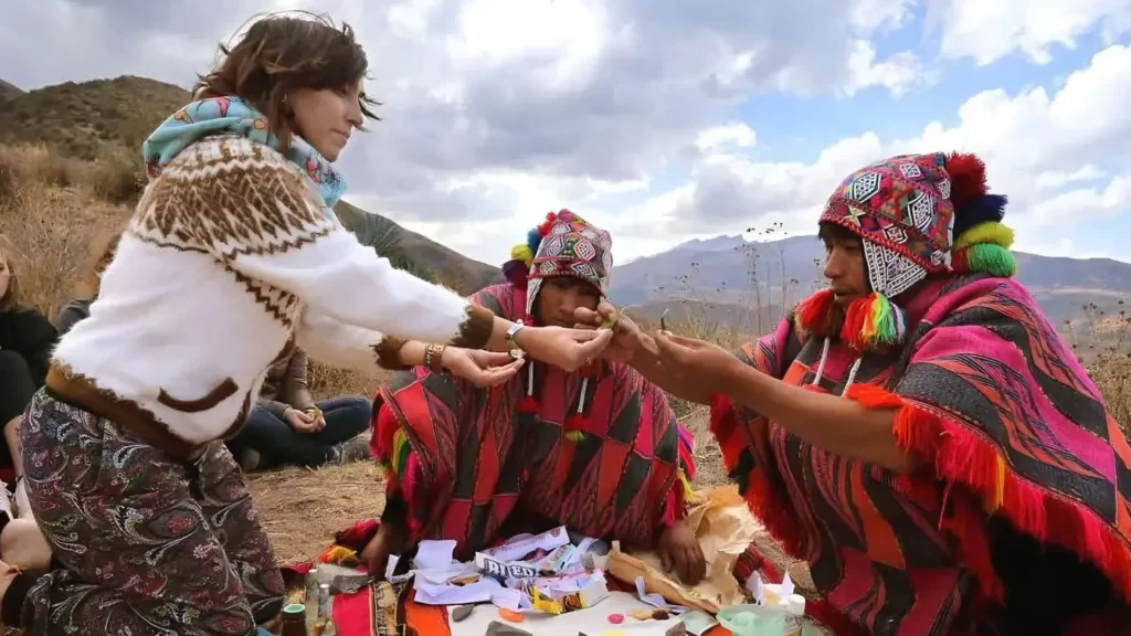 Tourist sharing with locals in a community tourism experience in Peru.